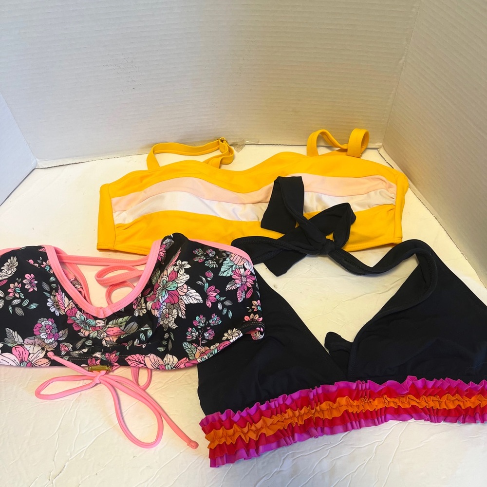 Three bikini tops size L!